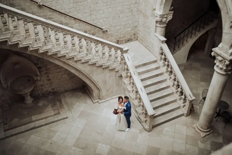 Wedding photoshoot at Rector’s Palace in Dubrovnik, Croatia, featuring Gothic-Renaissance stone architecture, elegant courtyard columns, and a historic Old Town setting for a destination wedding.