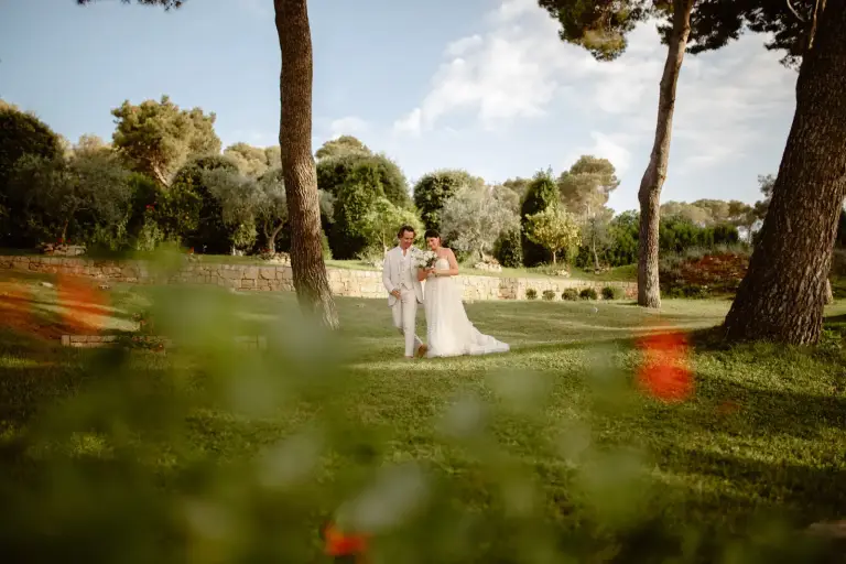 Bride and groom celebrating their wedding at Martinis Marchi Castle in Maslinica on Šolta Island, Croatia.