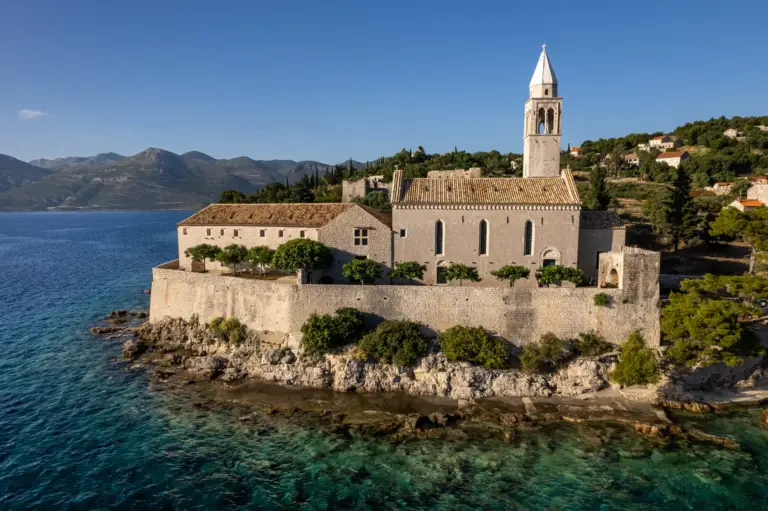 Wedding ceremony at the 1483 Monastery on Lopud Island, Croatia, featuring historic stone ruins, seaside views, and a peaceful island setting for a romantic destination wedding.