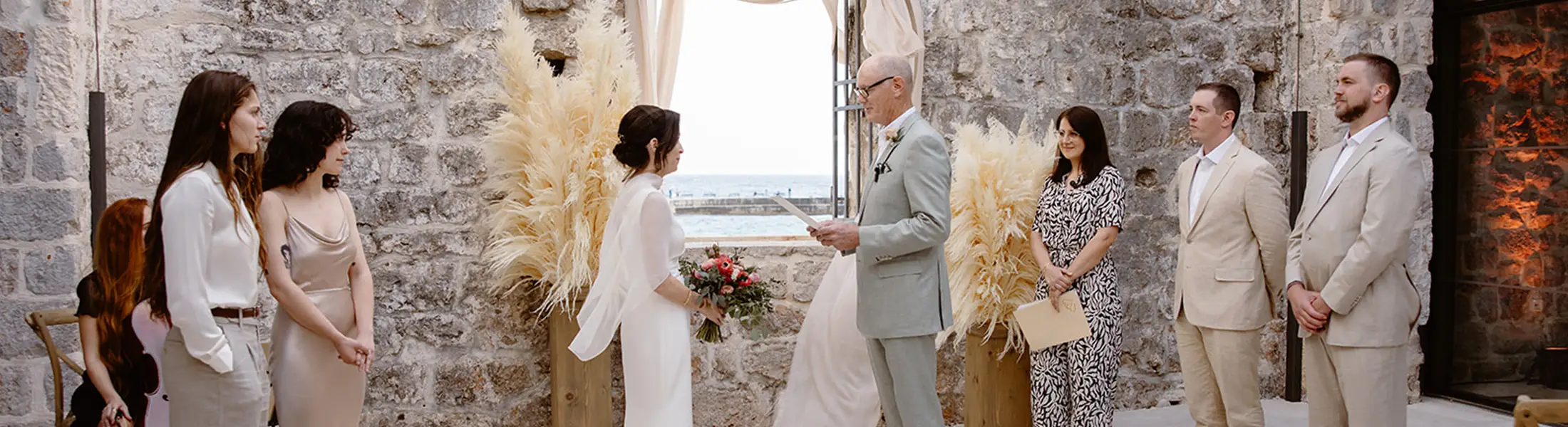 Couple renewing their wedding vows on a scenic seaside location in Croatia at sunset